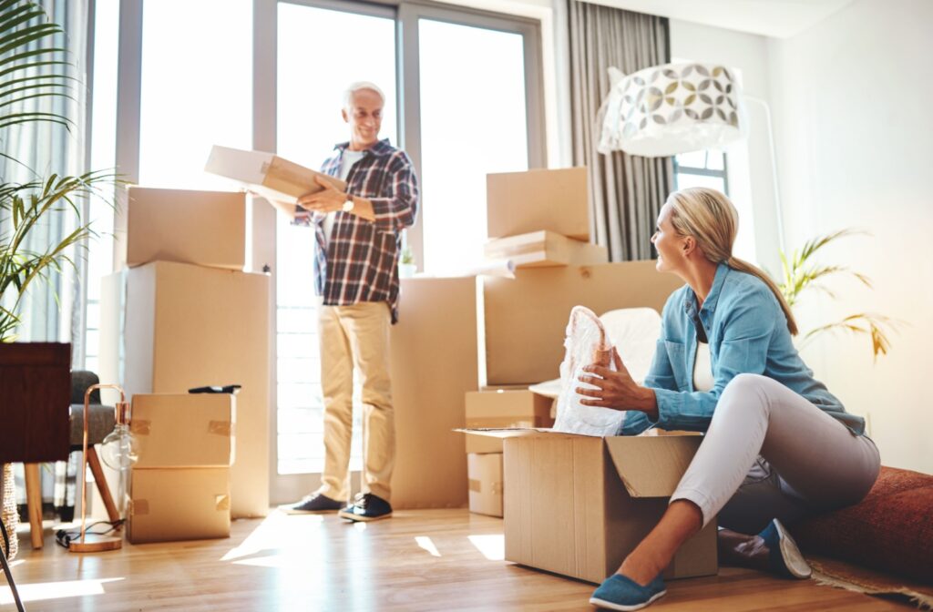 A senior couple packing their home to downsize for independent living.