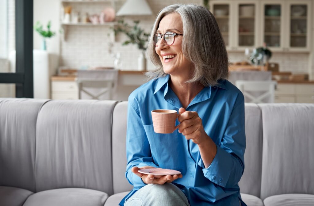 Senior woman enjoying a cup of coffee in a cozy senior living community